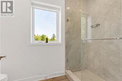 Rain head shower with porcelain tiles -