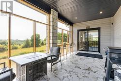 Expansive screened sunroom off dining room -