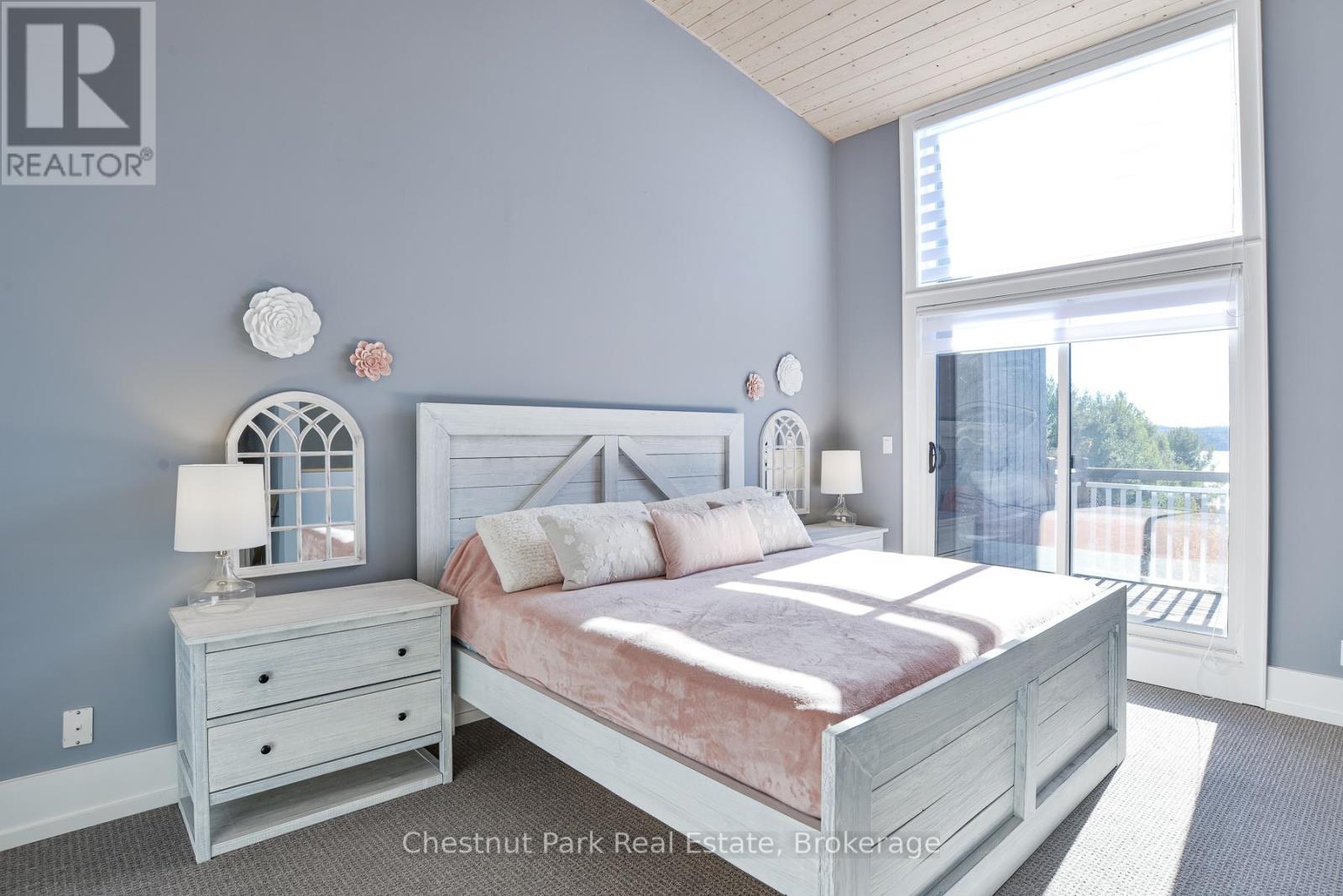 Primary Bedroom Suite - 4 Turner Drive, Huntsville (Chaffey), ON - Indoor Photo Showing Bedroom