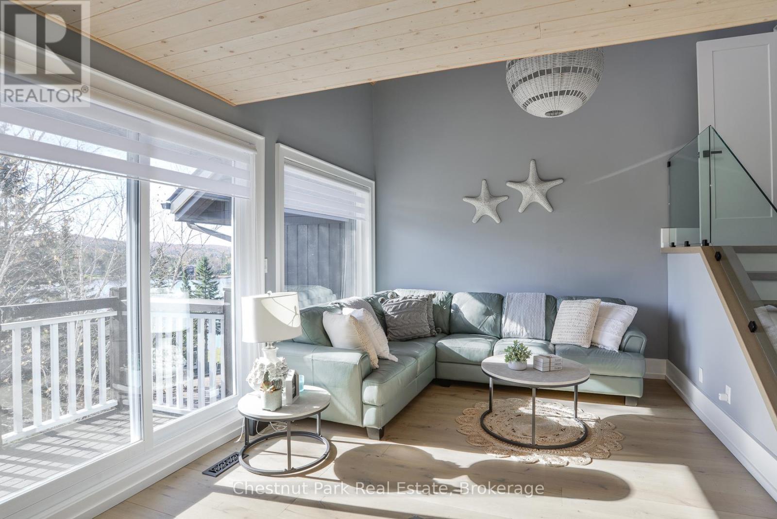 Living Room with Lake Views - 4 Turner Drive, Huntsville (Chaffey), ON - Indoor Photo Showing Living Room