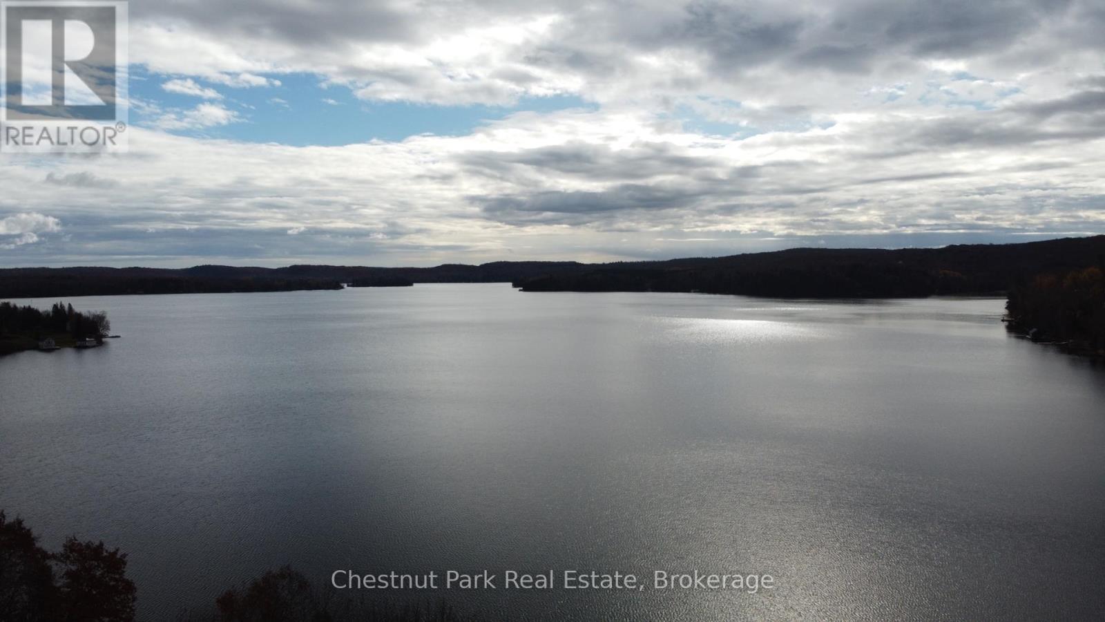 Enjoy Peninsula Lake - Part of a 4- Lake Chain - 4 Turner Drive, Huntsville (Chaffey), ON - Outdoor With Body Of Water With View