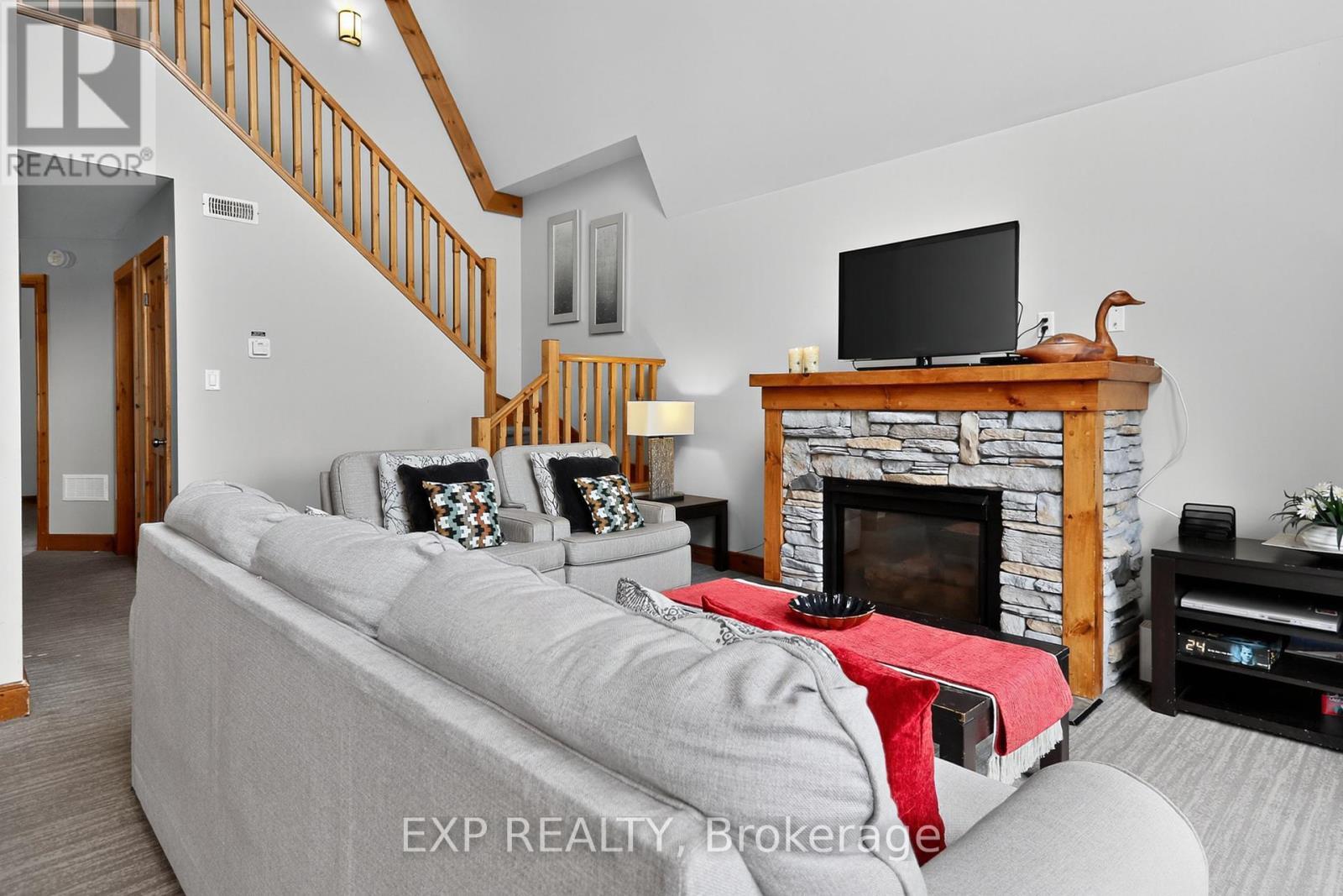 222 - 170 Snowbridge Way, Blue Mountains, ON - Indoor Photo Showing Living Room With Fireplace