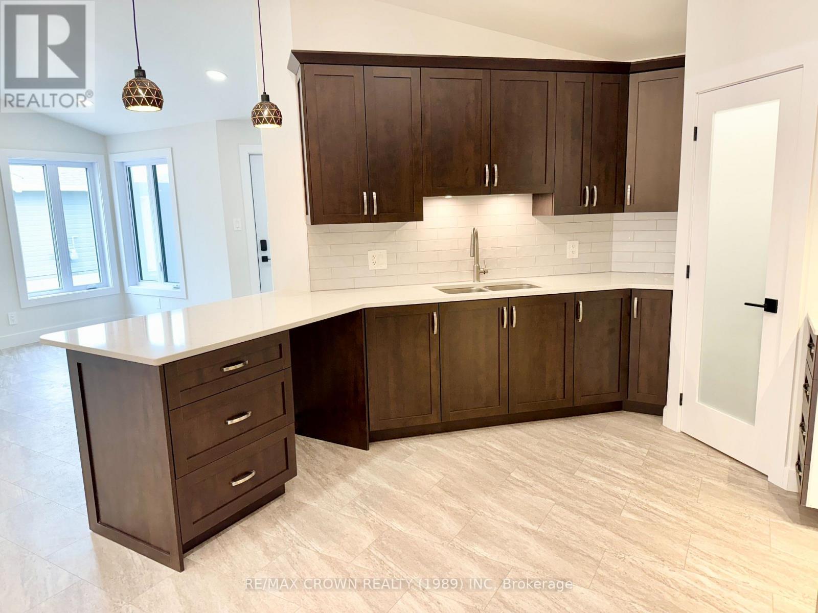 18 Golf Street, Kapuskasing, ON - Indoor Photo Showing Kitchen With Double Sink