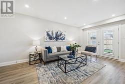 Living Room with a French Door Walkout to Backyard -