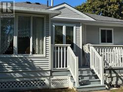 Back of house with deck -