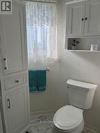 Linen closet and raised toilet -