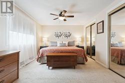 Large window with ceiling fan -