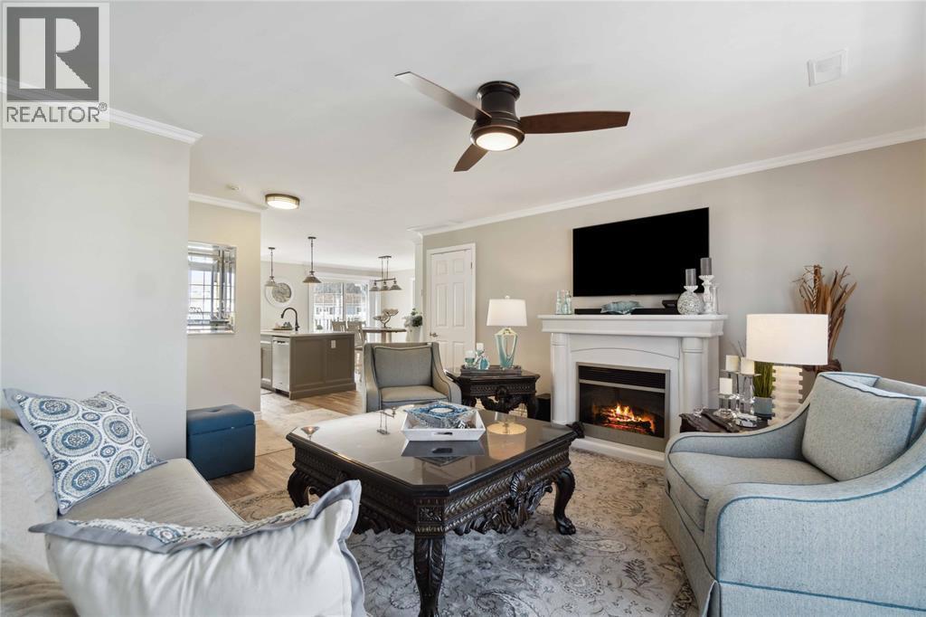 1510 Venetian Boulevard Unit# M7, Point Edward, ON - Indoor Photo Showing Living Room With Fireplace