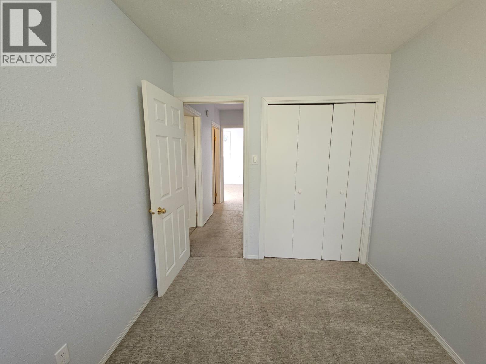 140-5100 53 Street Sw, Chetwynd, BC - Indoor Photo Showing Other Room