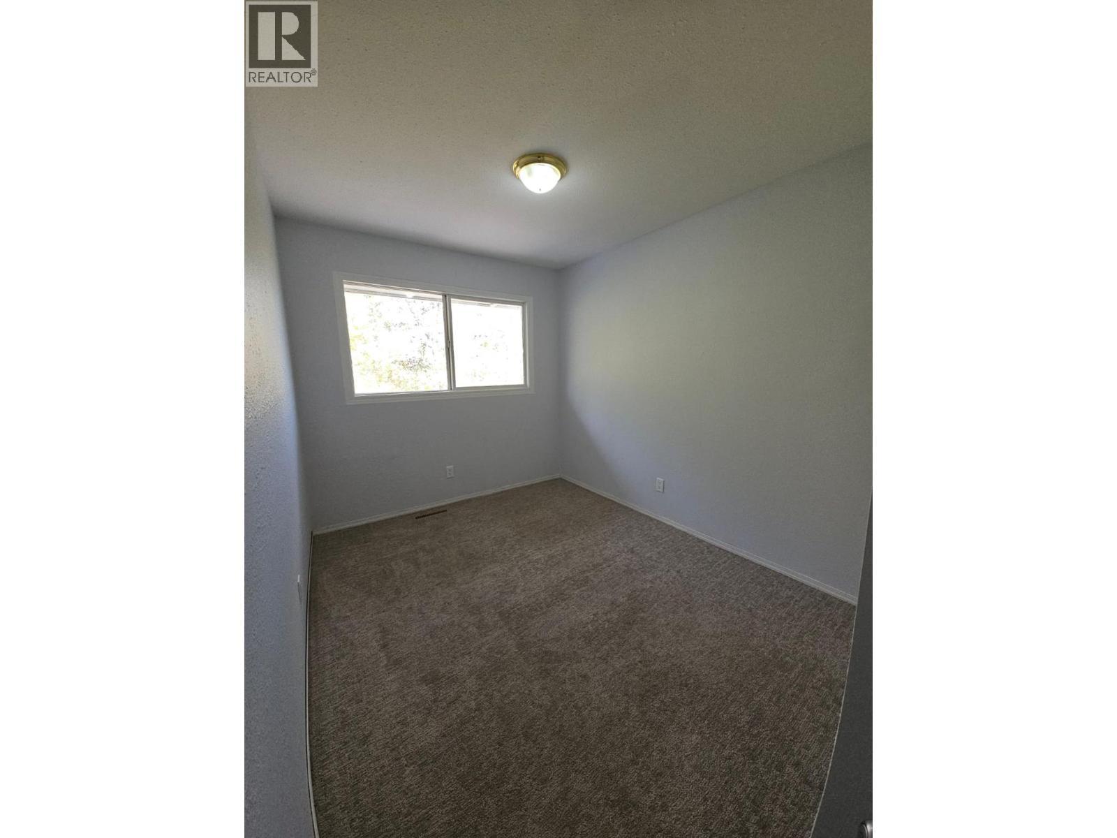 140-5100 53 Street Sw, Chetwynd, BC - Indoor Photo Showing Other Room