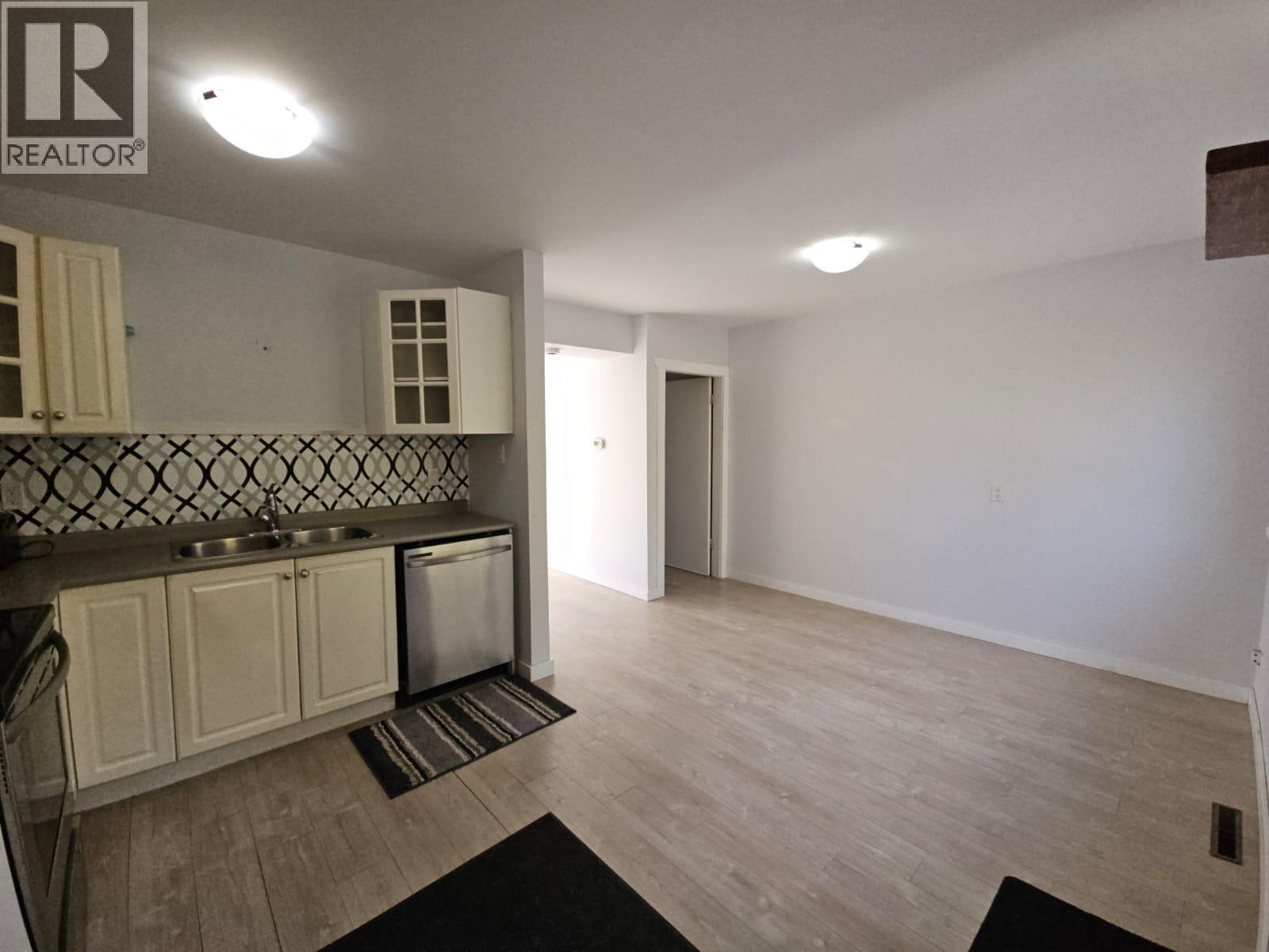 140-5100 53 Street Sw, Chetwynd, BC - Indoor Photo Showing Kitchen With Double Sink