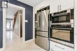 Built In appliances with Wine Rack above -