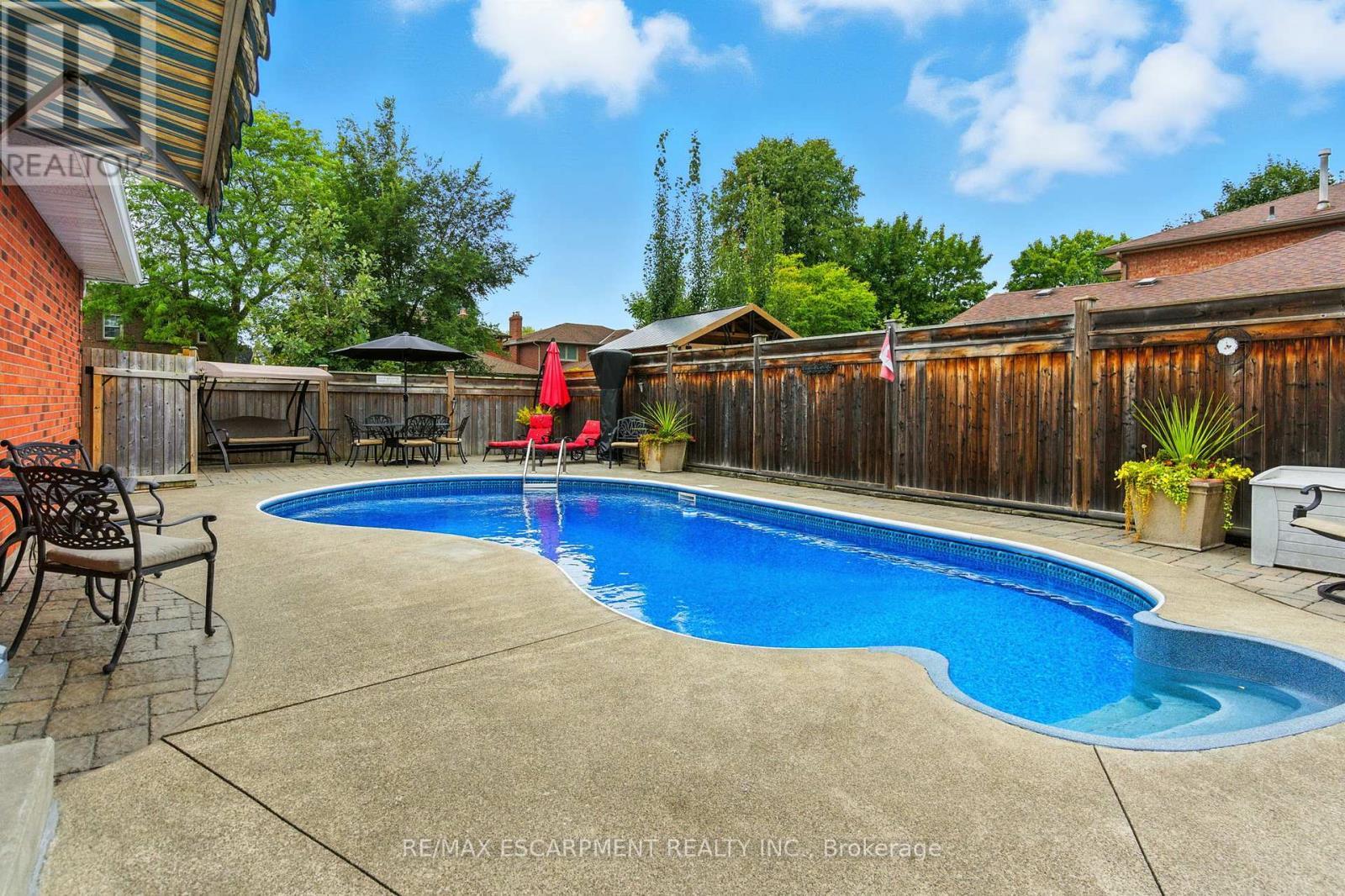561 Harmony Avenue, Burlington, ON - Outdoor With In Ground Pool With Deck Patio Veranda With Backyard