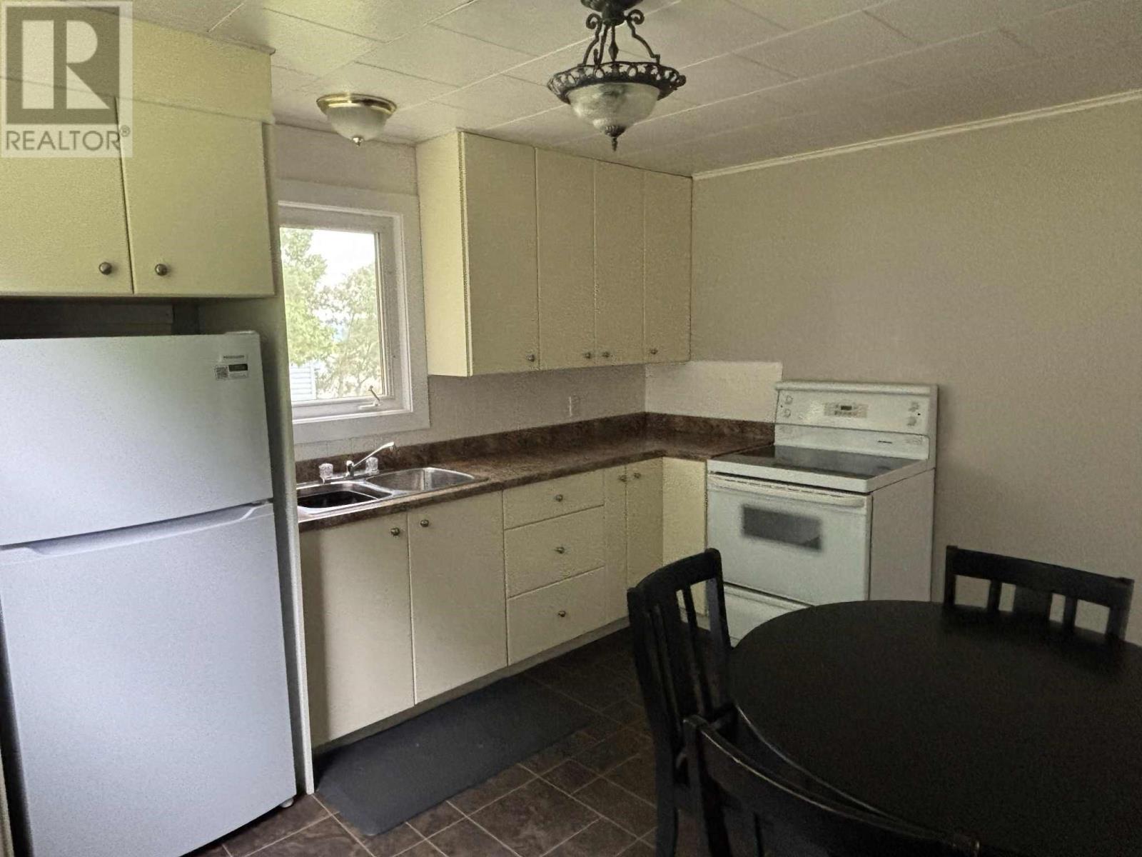 15-21 High Street, Baie Verte, NL - Indoor Photo Showing Kitchen With Double Sink