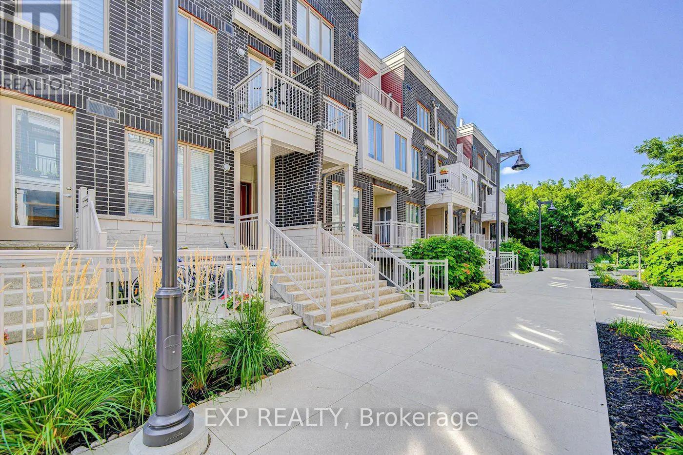 11 - 140 Long Branch Avenue, Toronto, ON - Outdoor With Facade