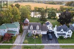 Showing both driveways, attached/detached garage -