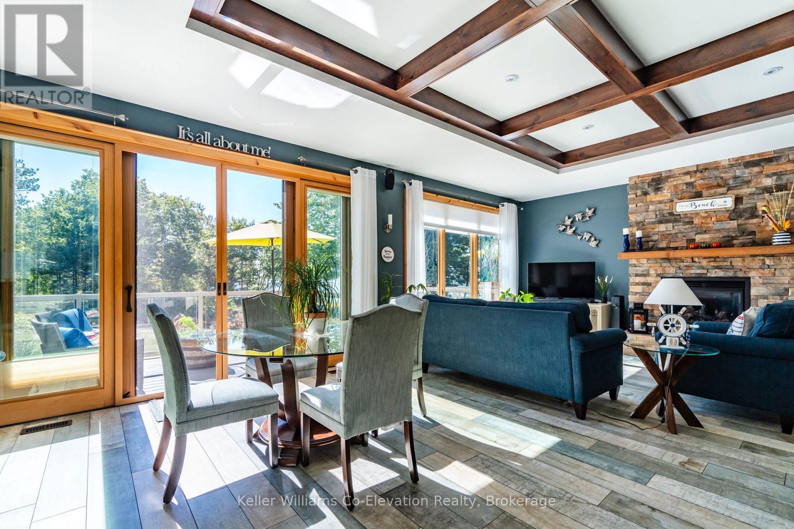 15 Rue De Parc, Tiny, ON - Indoor Photo Showing Dining Room With Fireplace