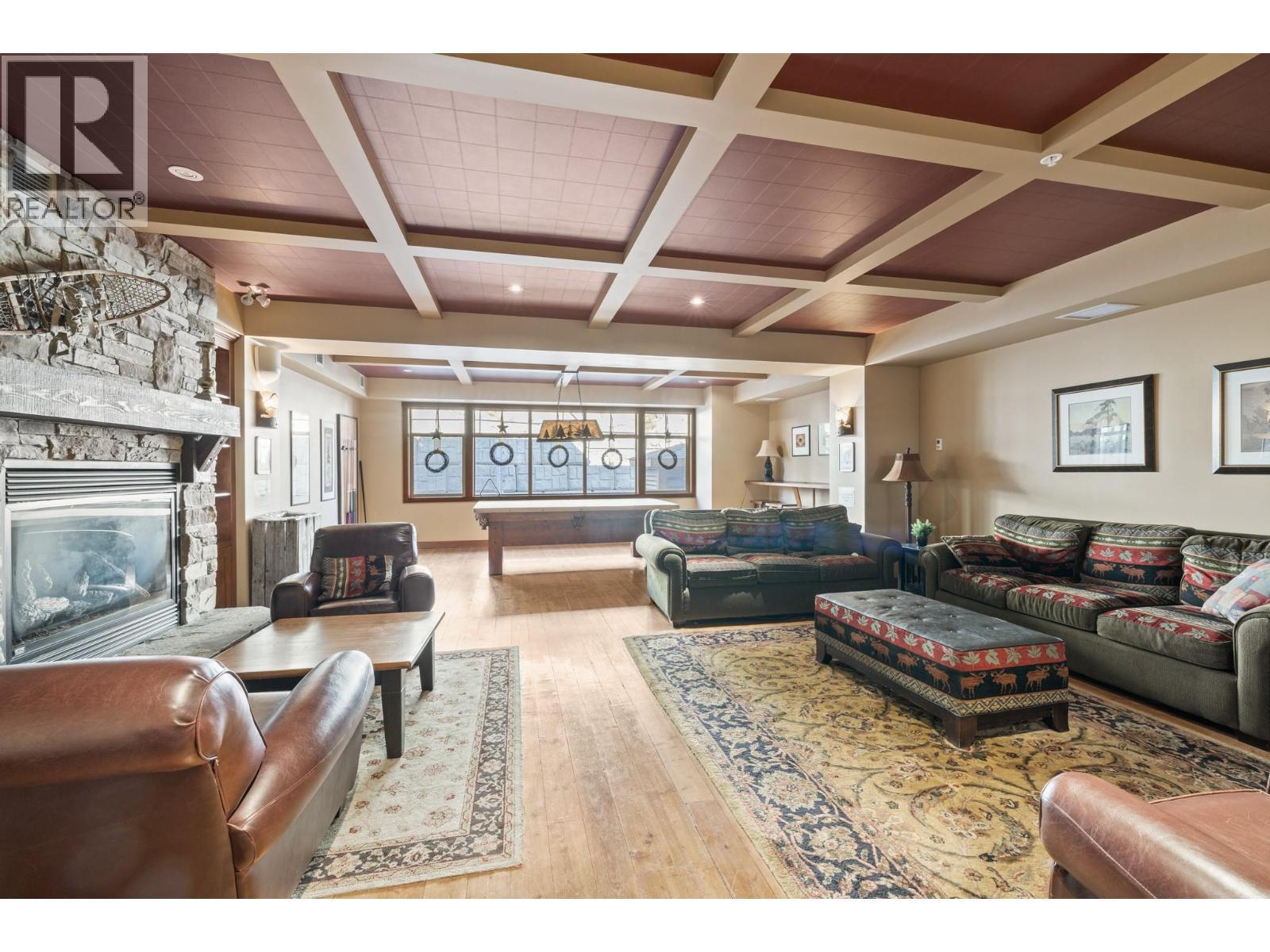 255 Feathertop Way Unit# 202, Big White, BC - Indoor Photo Showing Living Room With Fireplace