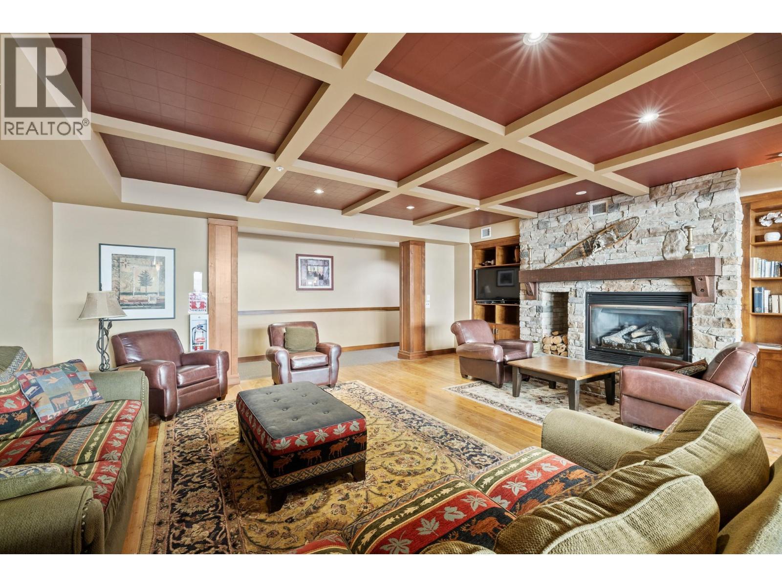 255 Feathertop Way Unit# 202, Big White, BC - Indoor Photo Showing Living Room With Fireplace