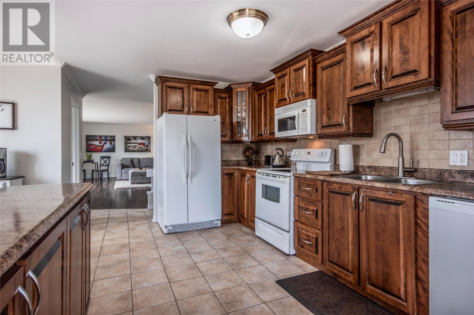 58 Front Road, Dildo, NL - Indoor Photo Showing Kitchen With Double Sink