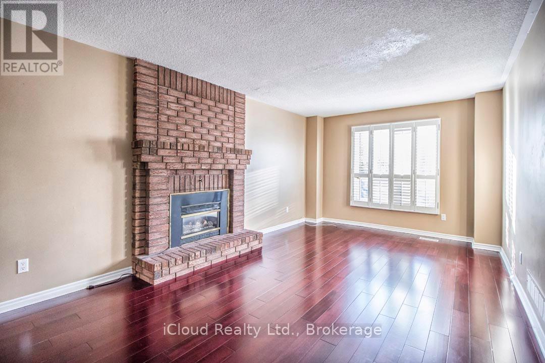 Main Floor Family Room with Brick Fireplace - 2667 Wynten Way, Oakville, ON - Indoor Photo Showing Other Room With Fireplace