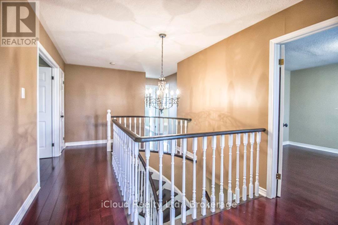 Second Floor Hallway with Hardwood Floors - 2667 Wynten Way, Oakville, ON - Indoor Photo Showing Other Room