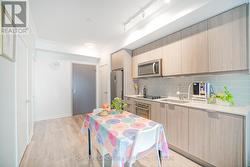 Kitchen and Living With New Crown Moulding -