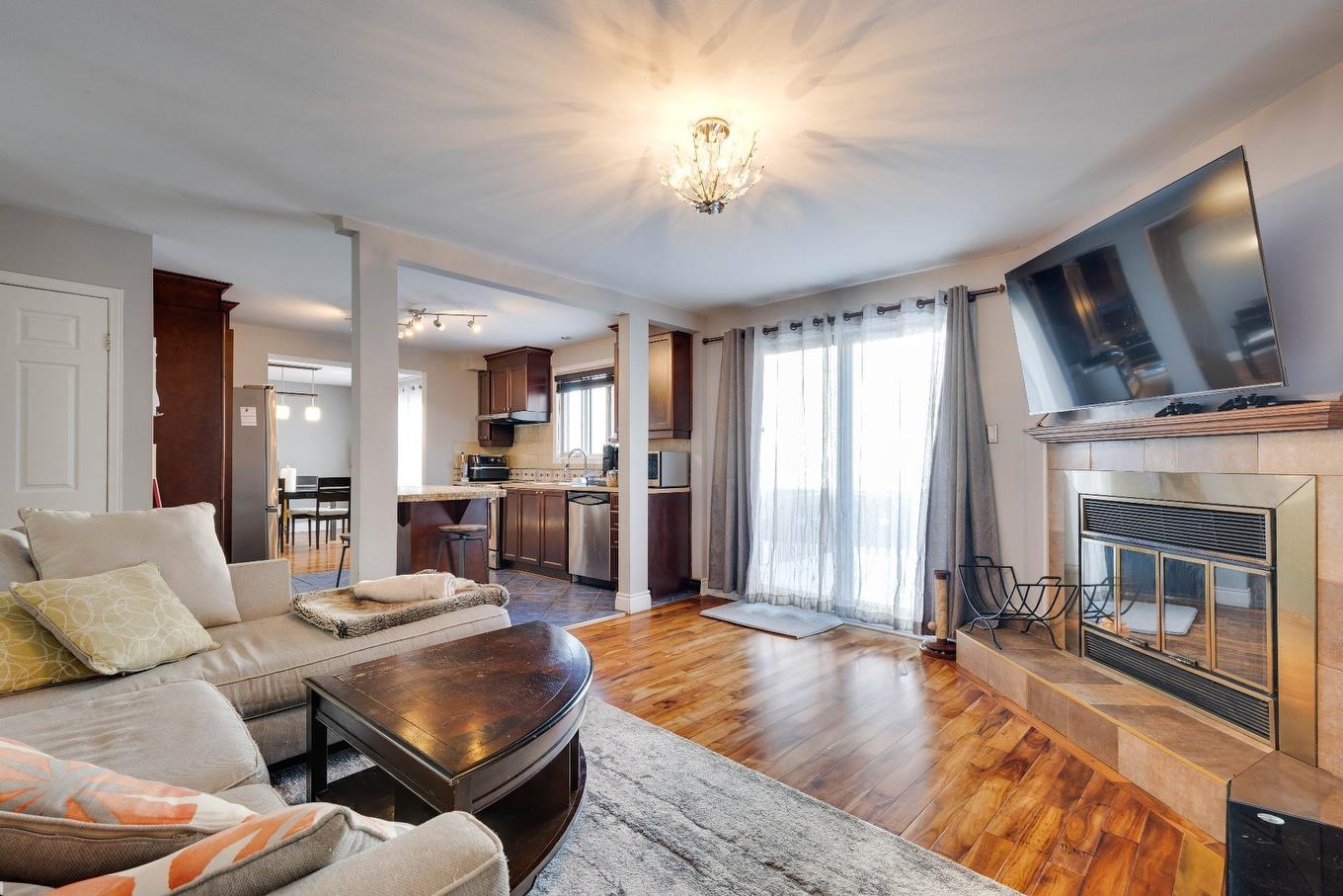 Family room - 4629 Rue Laprade, Laval (Chomedey), QC - Indoor Photo Showing Living Room With Fireplace