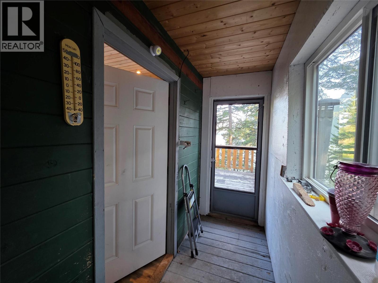 Door into home and door out to back deck - 6453 Pinaus Lake Road Lot# 6297, Falkland, BC - Photo Showing Other Room