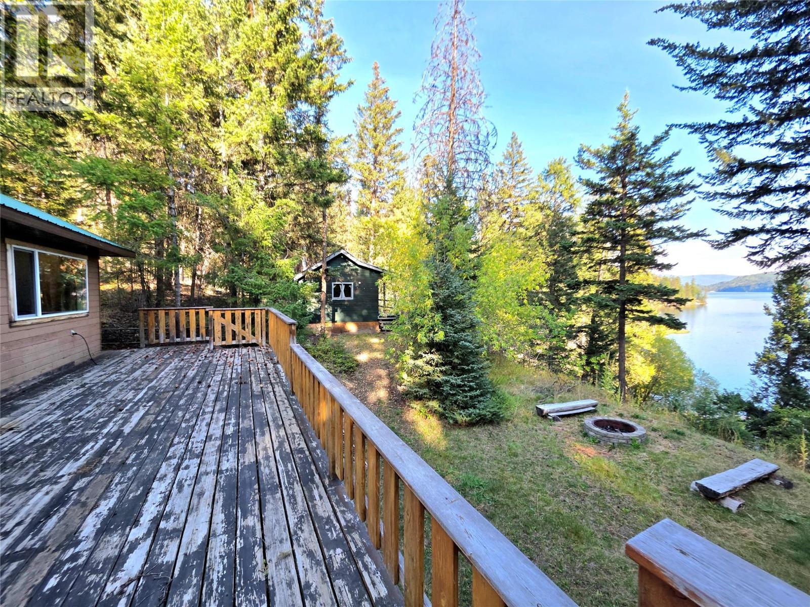 View from back deck towards the second cabin and lake - 6453 Pinaus Lake Road Lot# 6297, Falkland, BC - Outdoor With Deck Patio Veranda