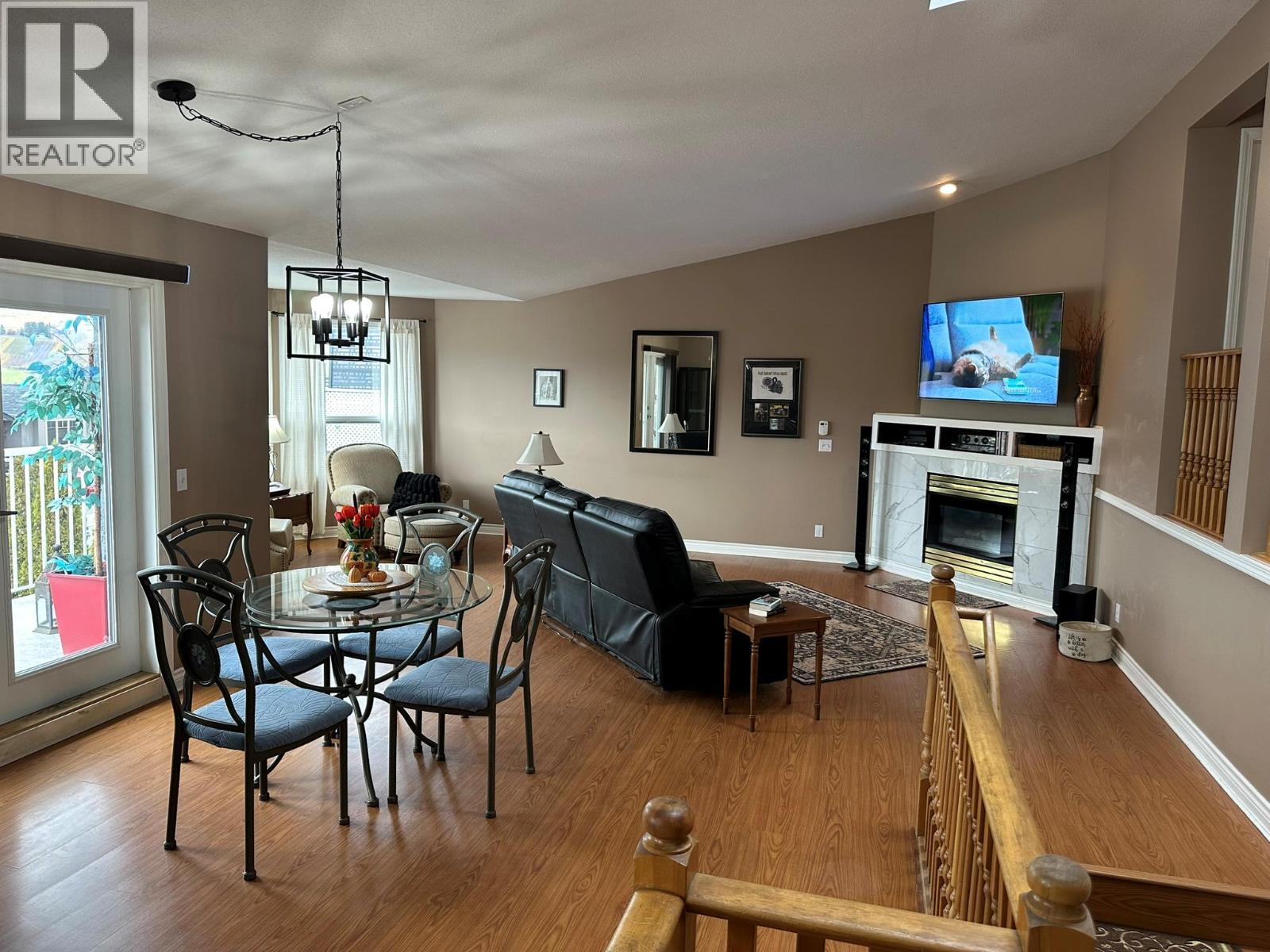 4712 Valleyview Place, Vernon, BC - Indoor Photo Showing Dining Room With Fireplace