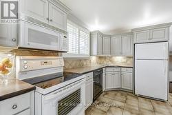 Light kitchen cupboards with plenty of lighting -