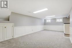 Spacious recreation rm with wainscotting -