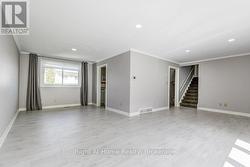 Lv/ Dn rm combo with laminate floors and potlights -