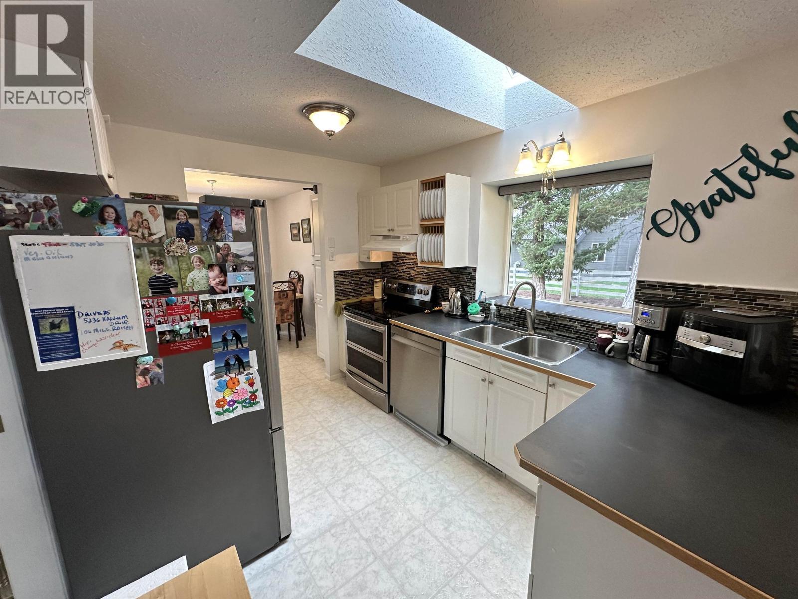 5236 Kallum Drive, 108 Mile Ranch, BC - Indoor Photo Showing Kitchen With Double Sink