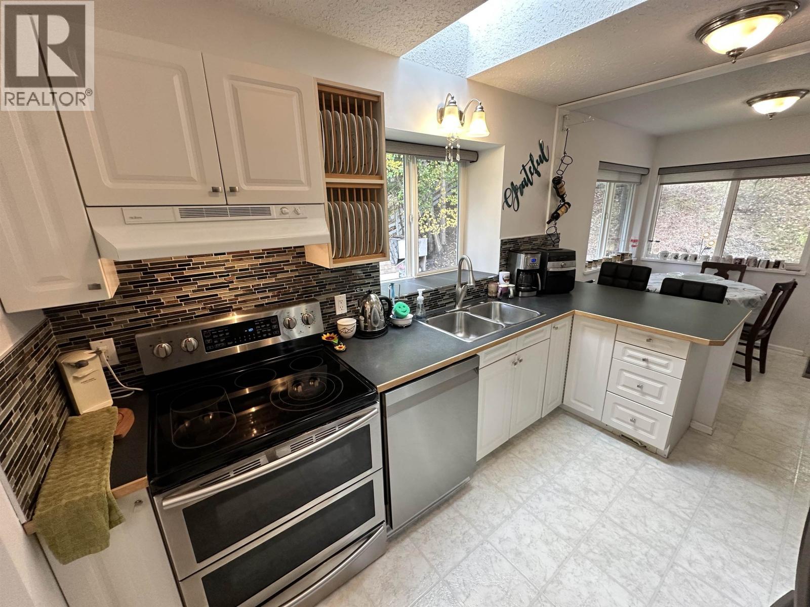 5236 Kallum Drive, 108 Mile Ranch, BC - Indoor Photo Showing Kitchen With Double Sink