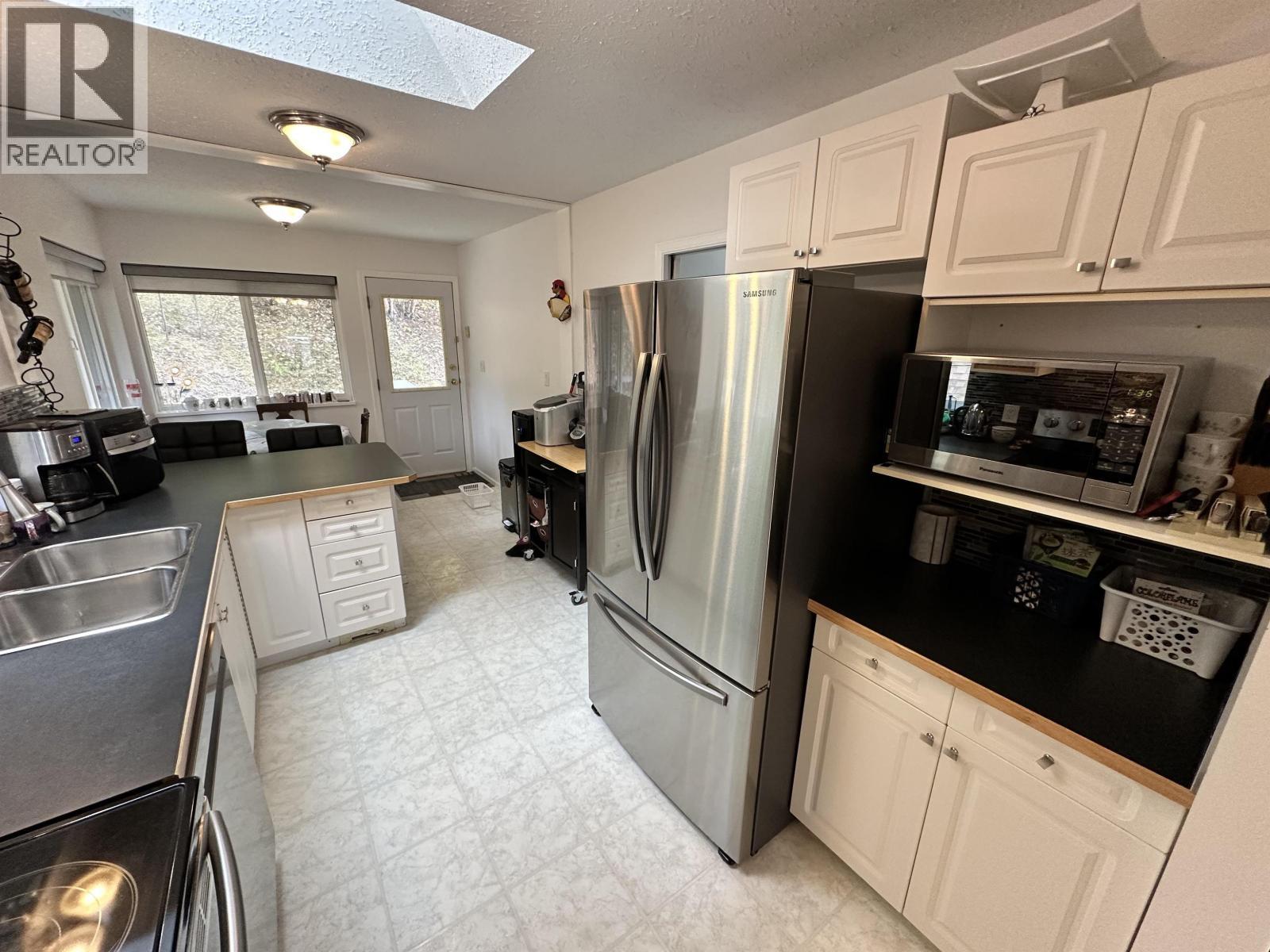 5236 Kallum Drive, 108 Mile Ranch, BC - Indoor Photo Showing Kitchen With Double Sink