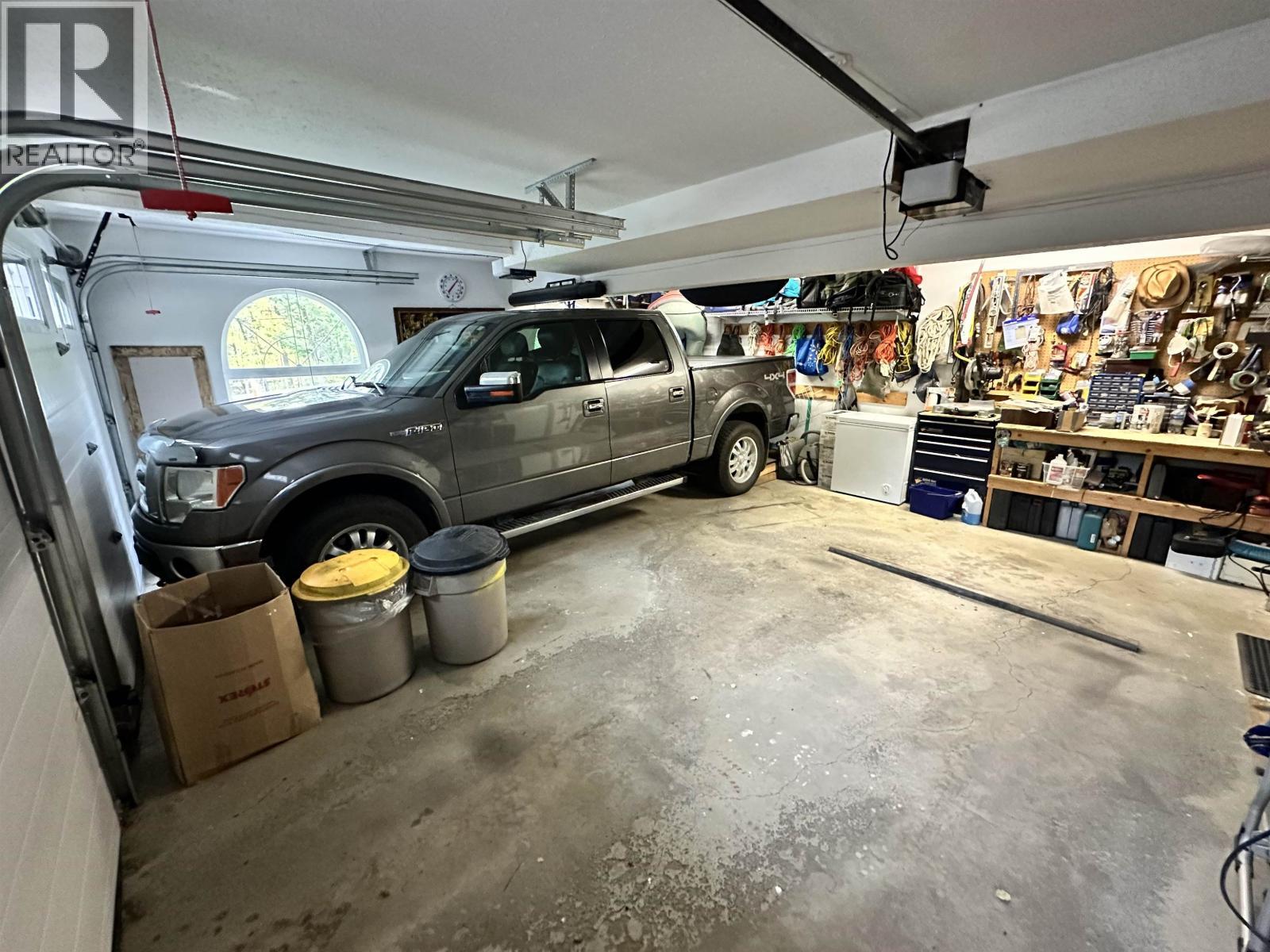 5236 Kallum Drive, 108 Mile Ranch, BC - Indoor Photo Showing Garage