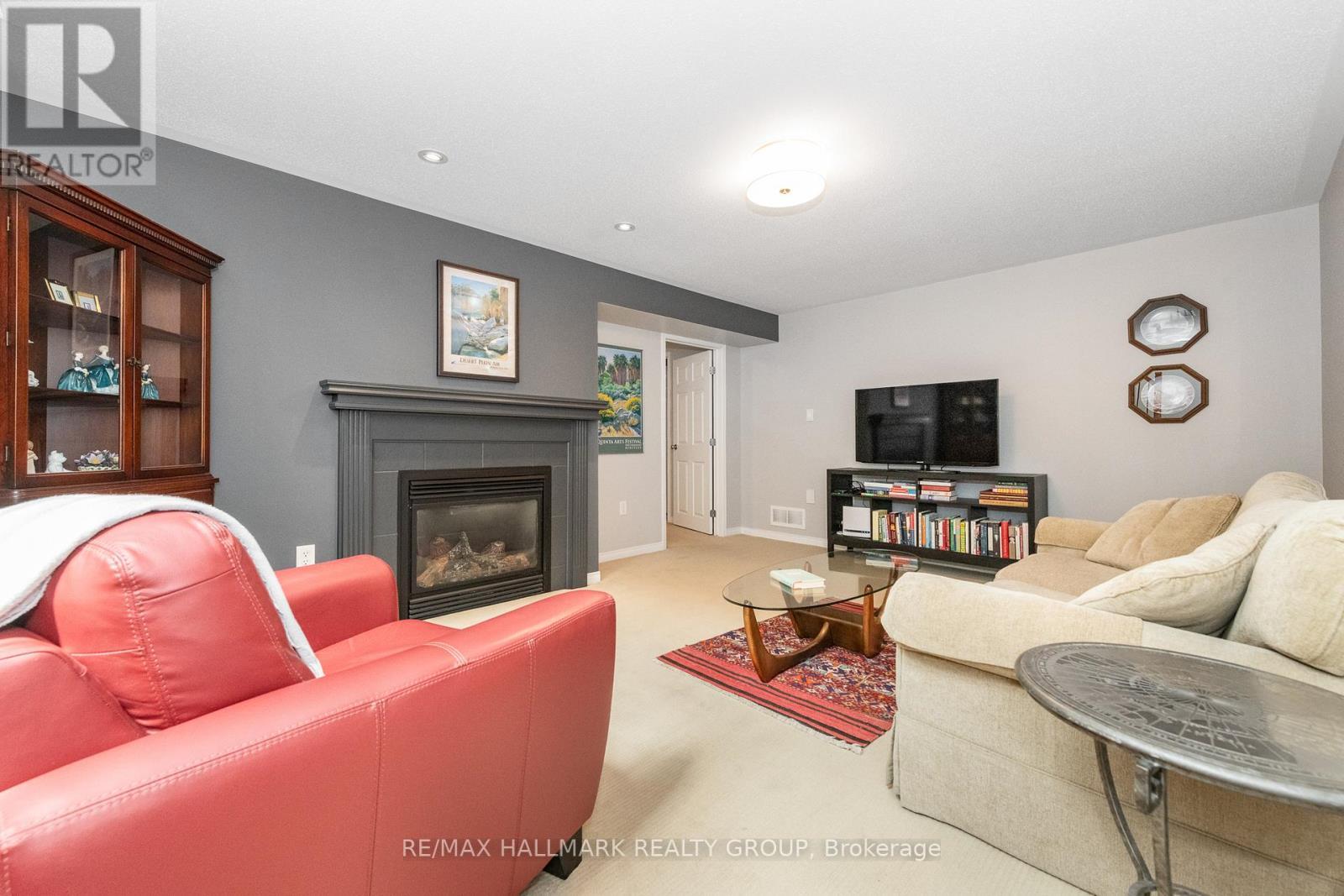 Recreation room with gas fireplace - 102 Kelso Private, Ottawa, ON - Indoor Photo Showing Living Room With Fireplace