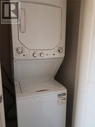 303 - 150 Main Street W, Hamilton, ON - Indoor Photo Showing Laundry Room