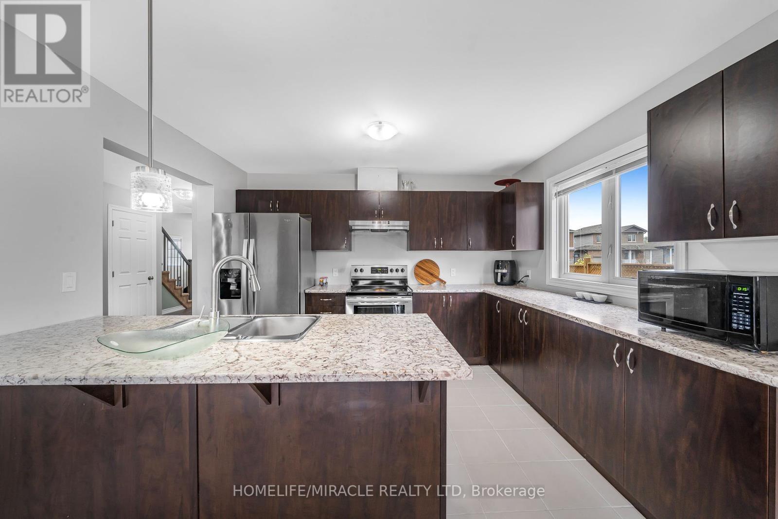 63 Brennan Crescent, Loyalist, ON - Indoor Photo Showing Kitchen With Double Sink With Upgraded Kitchen
