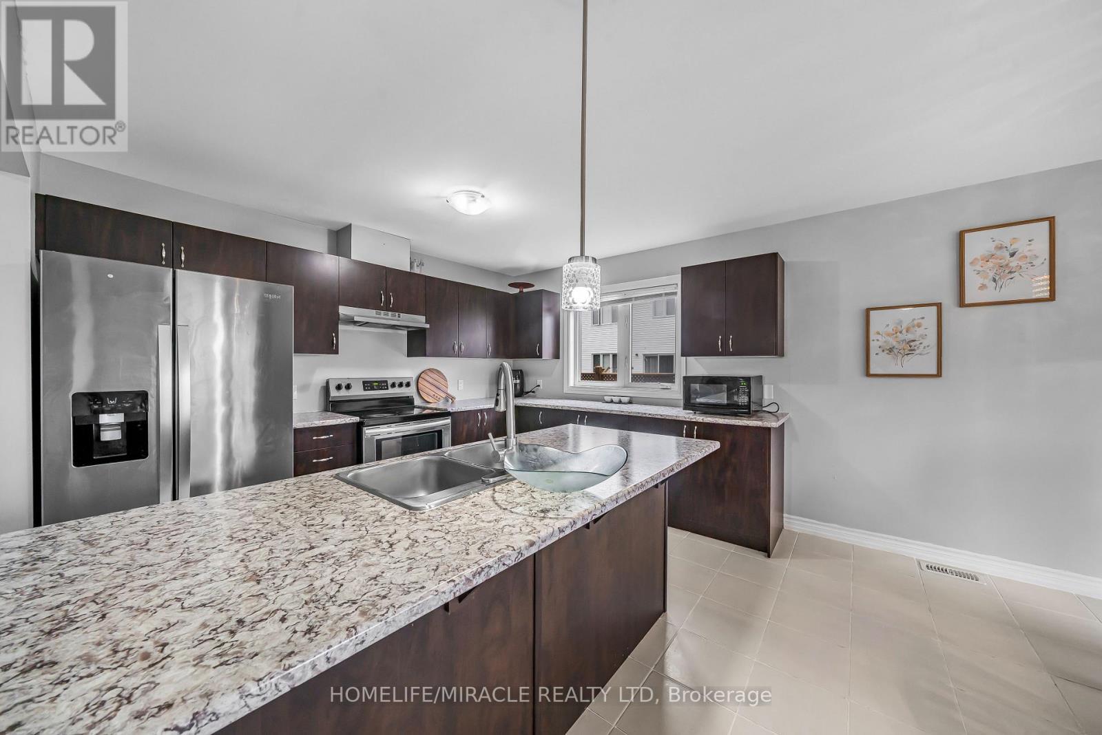 63 Brennan Crescent, Loyalist, ON - Indoor Photo Showing Kitchen With Upgraded Kitchen