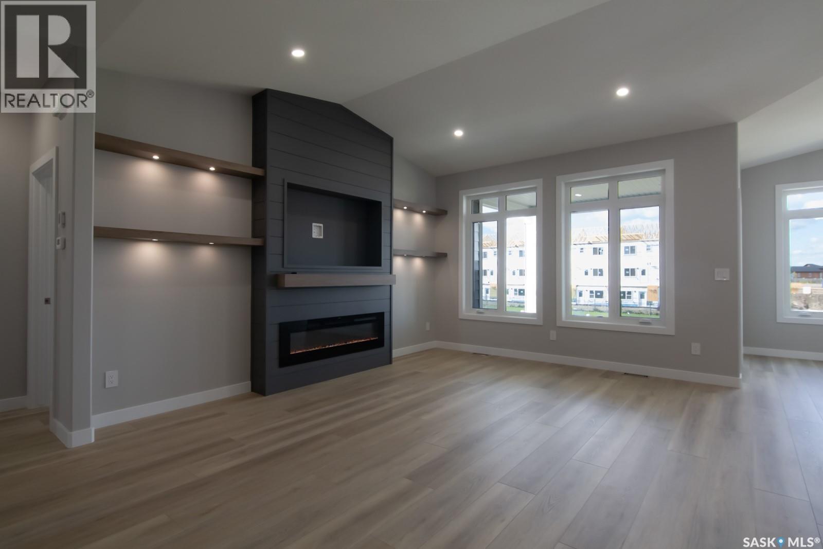 423 Sharma Crescent, Saskatoon, SK - Indoor Photo Showing Living Room With Fireplace