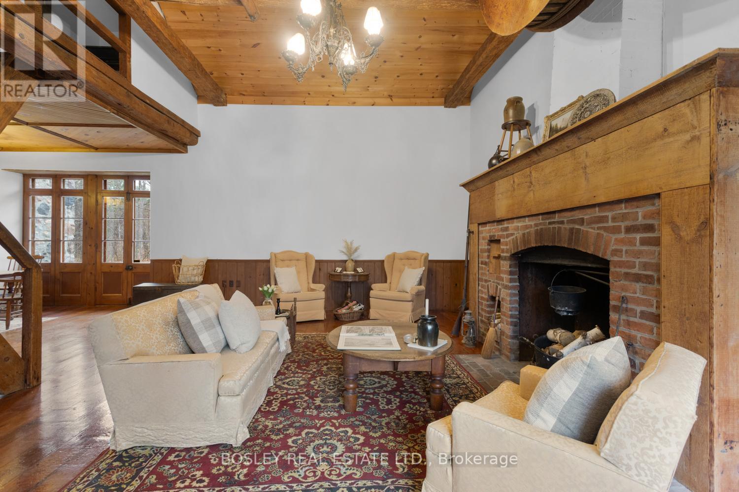2247 Van Luven Road, Hamilton Township (Baltimore), ON - Indoor Photo Showing Living Room With Fireplace