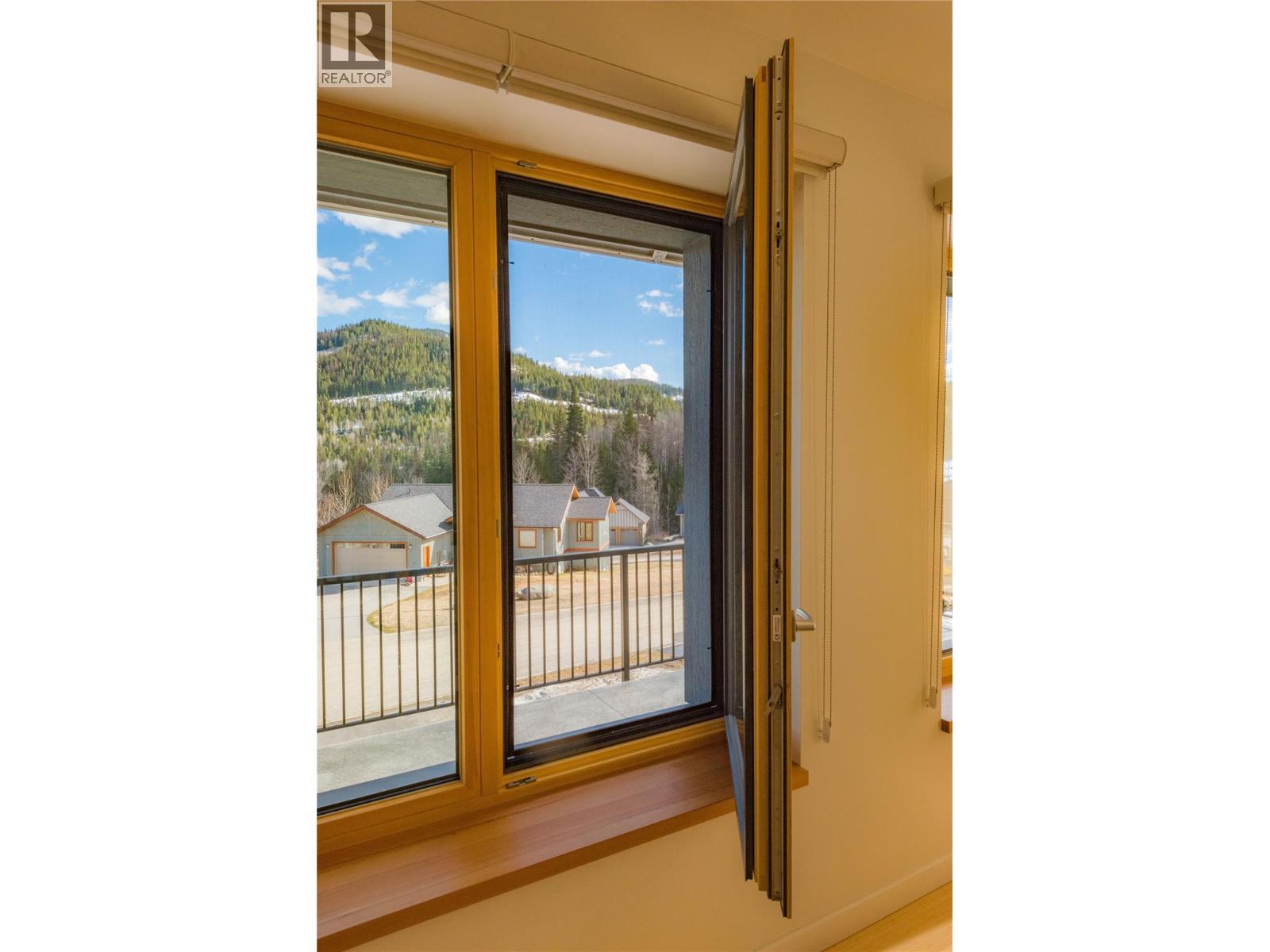 tilt and turn triple pane windows - 1006 Silvertip Road, Rossland, BC - Photo Showing Other Room