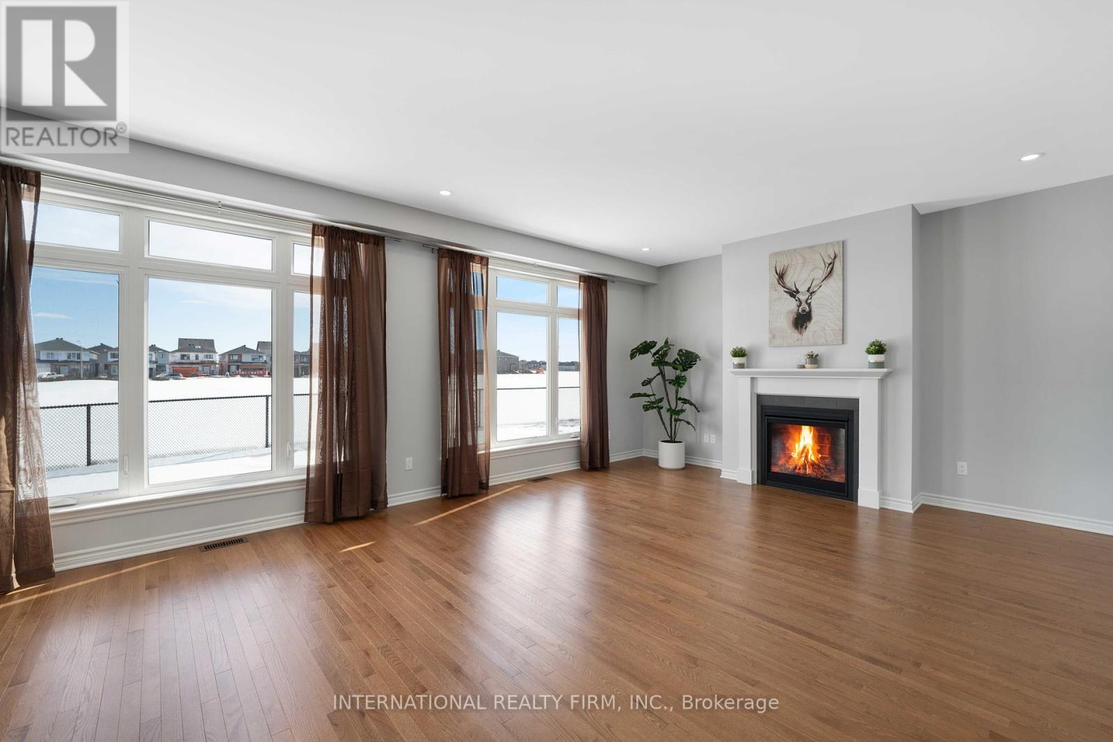 696 Moonflower Crescent N, Ottawa, ON - Indoor Photo Showing Living Room With Fireplace