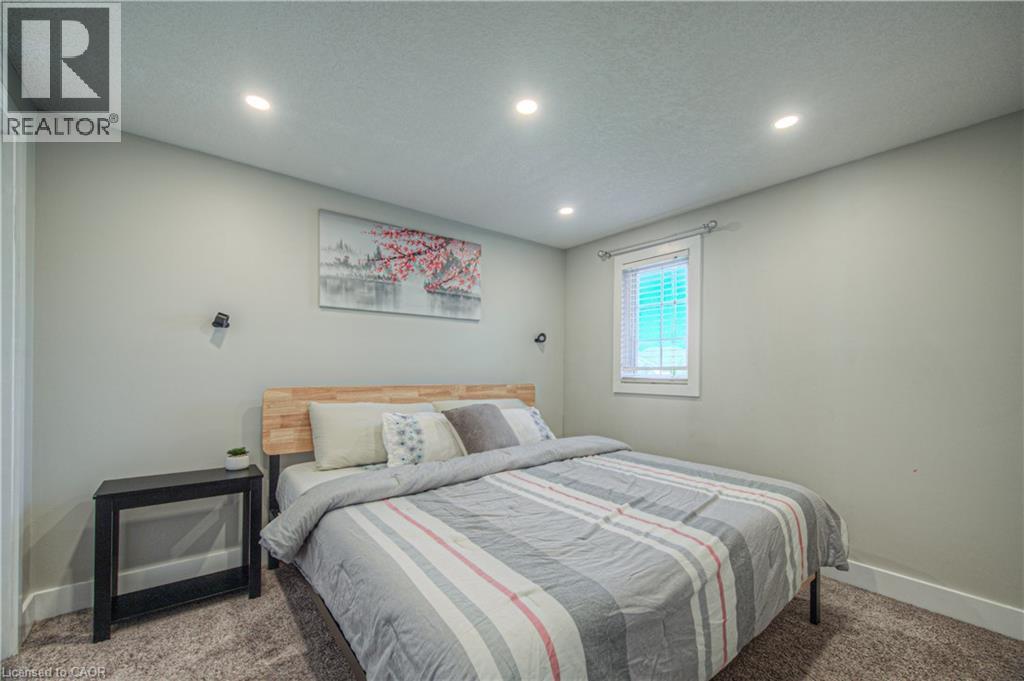 Bedroom with carpet floors, recessed lighting, and a textured ceiling - 220 Sienna Crescent, Kitchener, ON - Indoor Photo Showing Bedroom