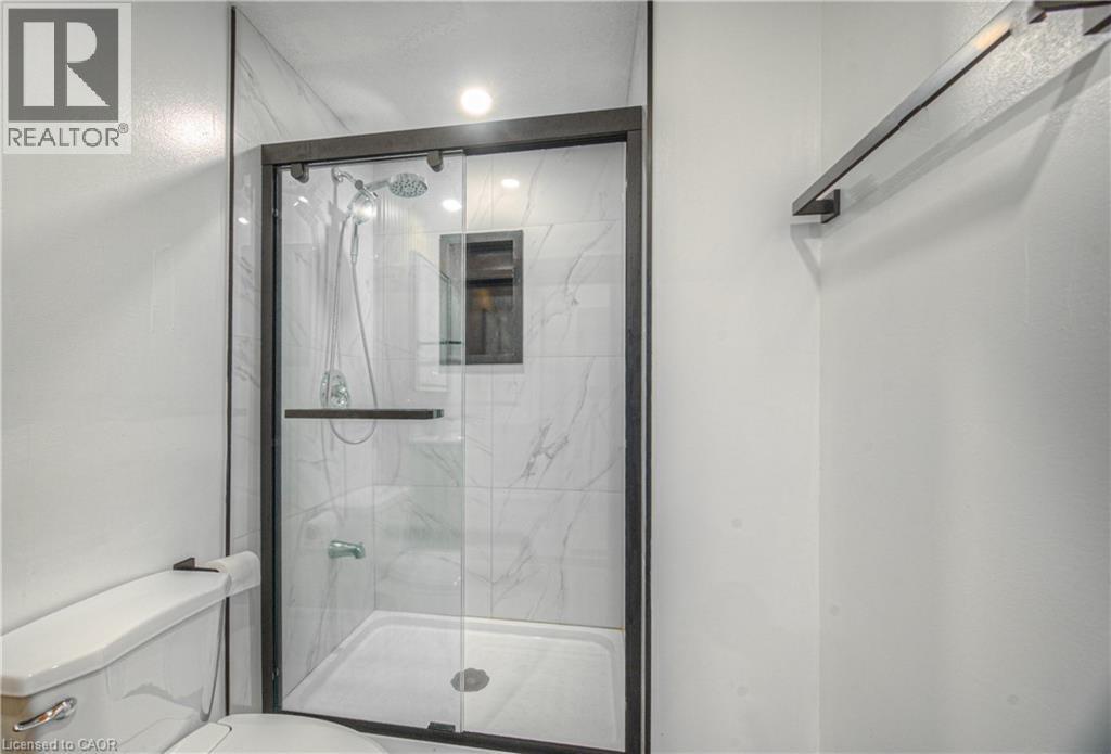 Bathroom with a marble finish shower - 220 Sienna Crescent, Kitchener, ON - Indoor Photo Showing Bathroom