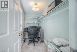 Office featuring light colored carpet and a textured ceiling -