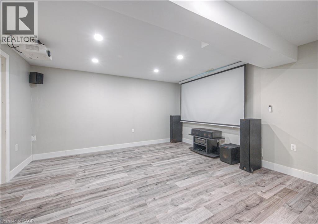Cinema room featuring light wood-style flooring and recessed lighting - 220 Sienna Crescent, Kitchener, ON - Indoor Photo Showing Basement